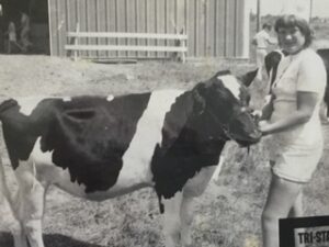 Laura Kuntz with blue ribbon heifer at the 1973 county fair