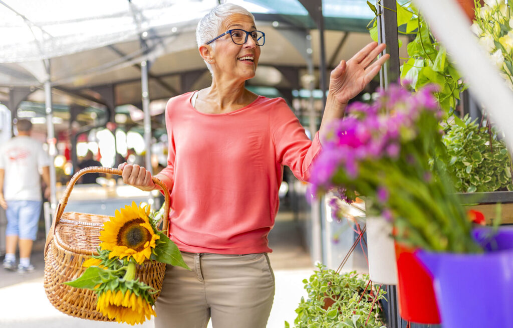 retired woman in flower market